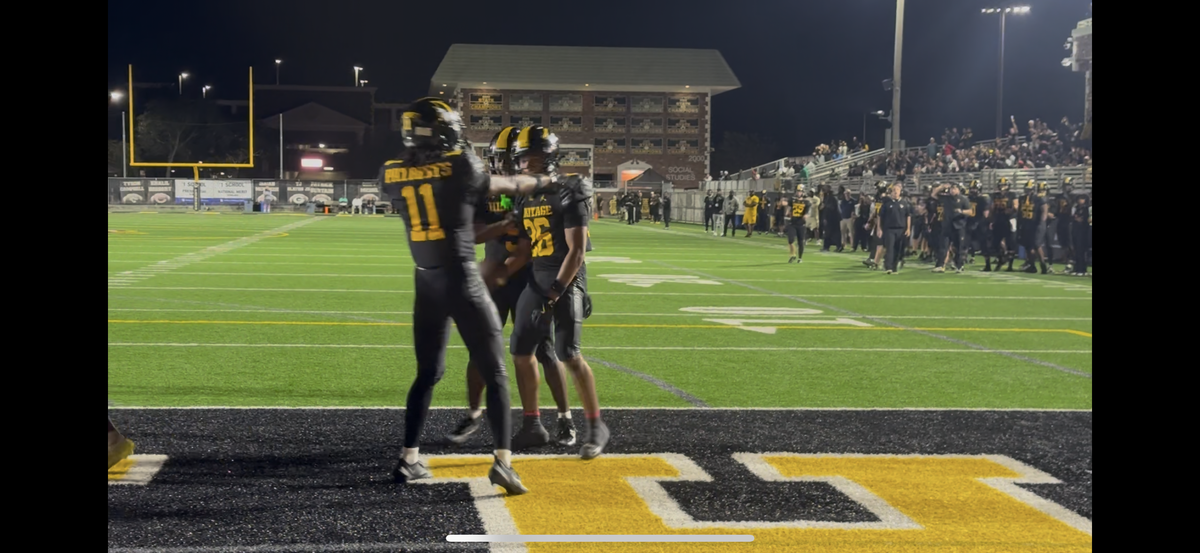 American Heritage’s Brandon Bennett celebrates with a teammate after a touchdown during their 48-7 win over Plantation on Friday at Heritage.