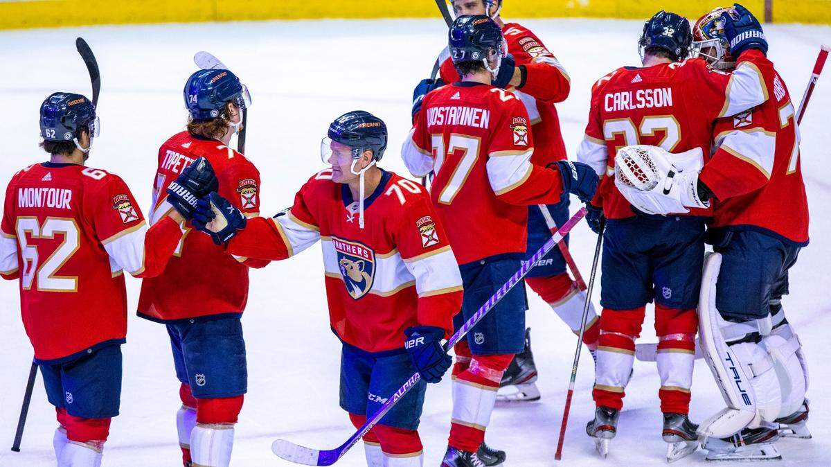Florida Panthers winger Patric Hornqvist (7) celebrates with teammates after defeating the Calgary Flames 6-2 during an NHL game at FLA Live Arena in Sunrise, Florida, on Tuesday, January 4, 2022.