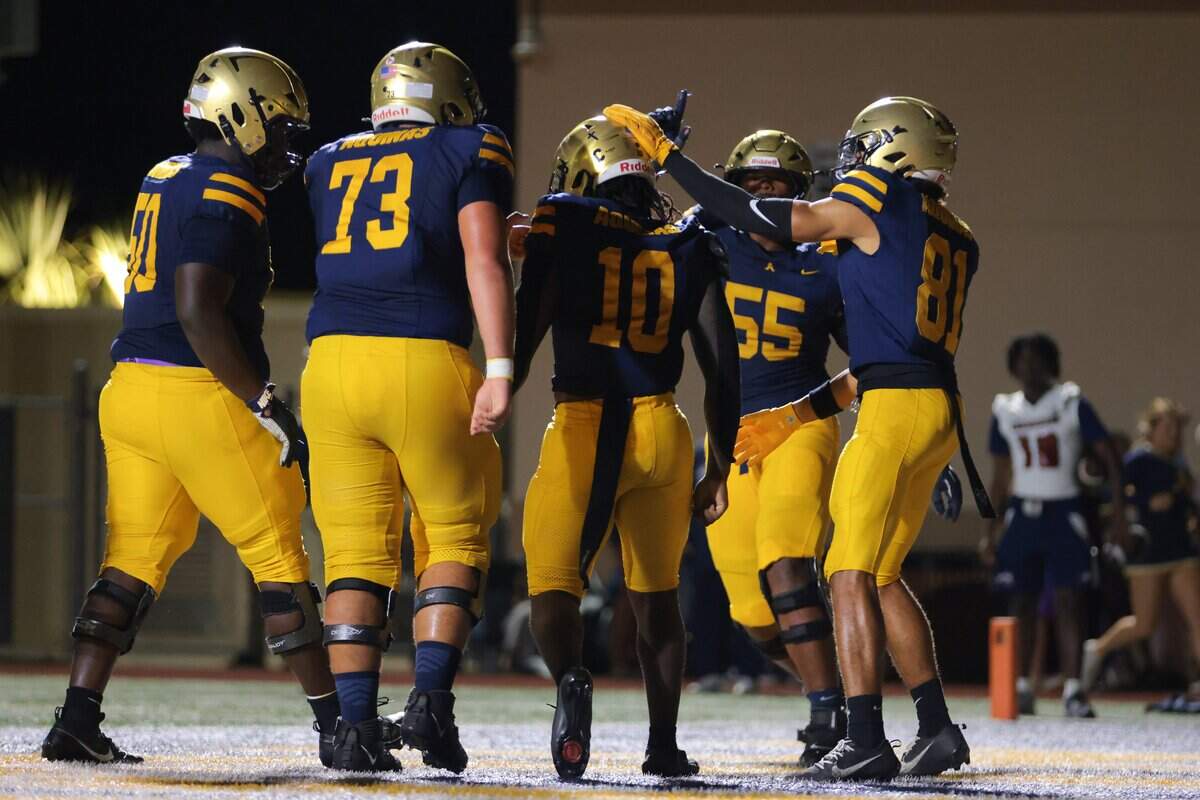 St. Thomas Aquinas Raiders linebacker Duke Daley (10) celebrates with teammates after scoring a touchdown against the Chaminade-Madonna Lions during the second quarter of a high school football game at St. Thomas Aquinas in Fort Lauderdale, Florida, Friday, October 31, 2025.