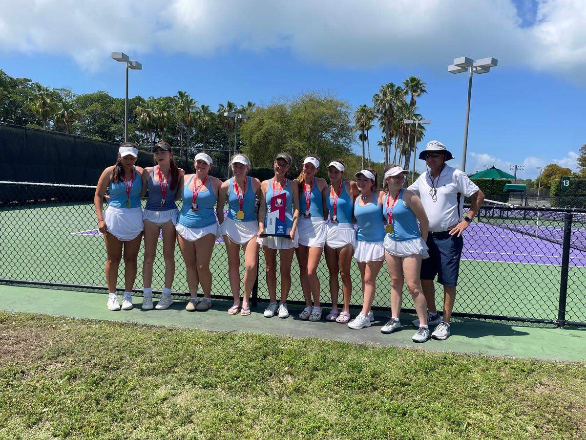 The Palmetto girls’ tennis team celebrates after repeating as GMAC champions on Tuesday afternoon at Crandon Park in Key Biscayne, Fla.