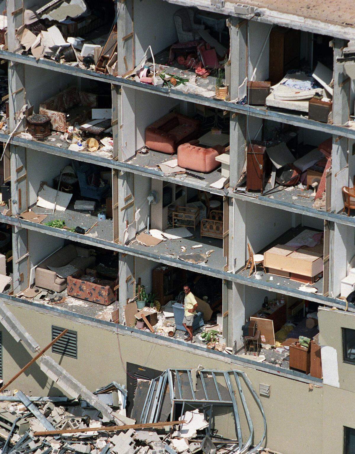 In this file photo from Aug. 25, 1992, residents at the Saga Bay apartment complex see firsthand what happened to their units after Hurricane Andrew blasted South Miami-Dade a day earlier on Aug. 24, 1992. Here, a man is seen inside his unit.