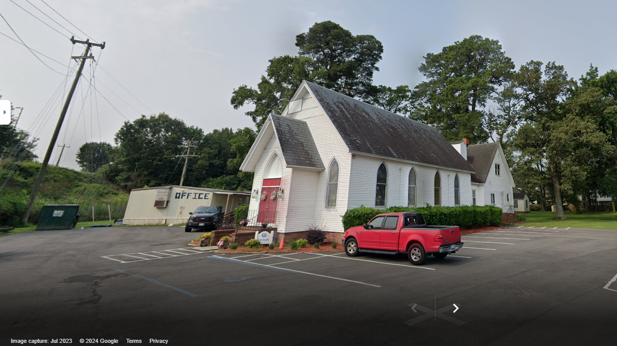 A body was found inside a burning dumpster outside of a church in Virginia, authorities said.