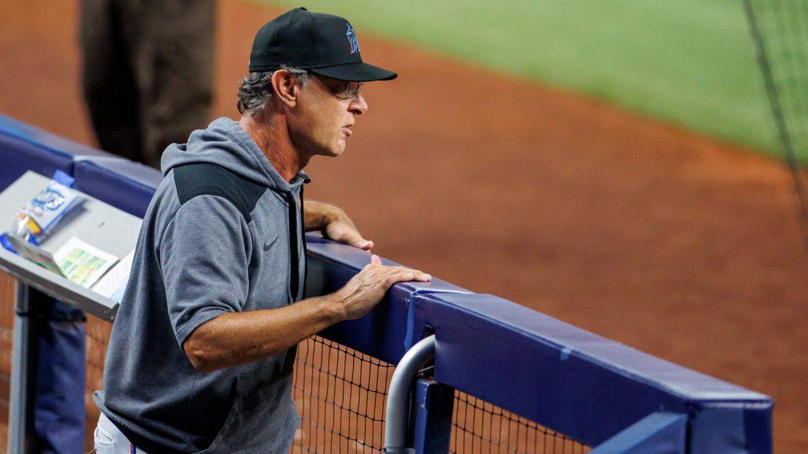 Miami Marlins manager Don Mattingly (8) looks from the dugout during the ninth inning of a baseball game against the Tampa Bay Rays at LoanDepot Park on Wednesday, August 31, 2022 in Miami, Florida.