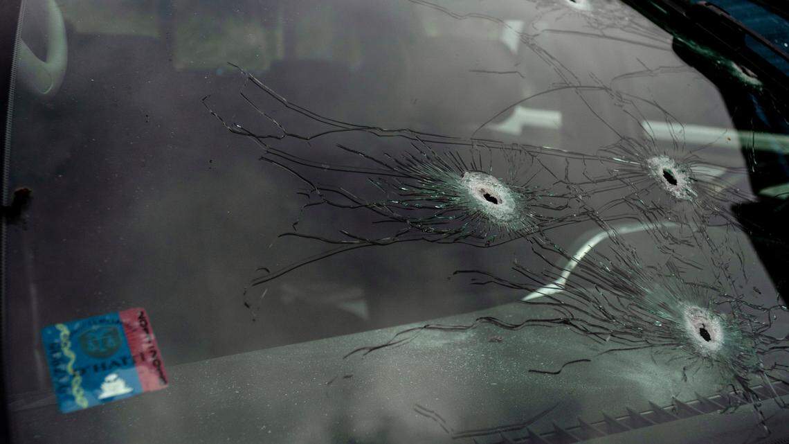 Bullet holes cover the windshield of journalist Roberson Alphonse’s car after he was attacked in Port-au-Prince, Haiti, Tuesday, Oct. 25, 2022. Alphonse, who works at the daily newspaper Le Nouvelliste and radio station Magik9, is hospitalized but is expected to recover, according to Frantz Duval, chief editor for both media. He said Alphonse has undergone two operations so far.