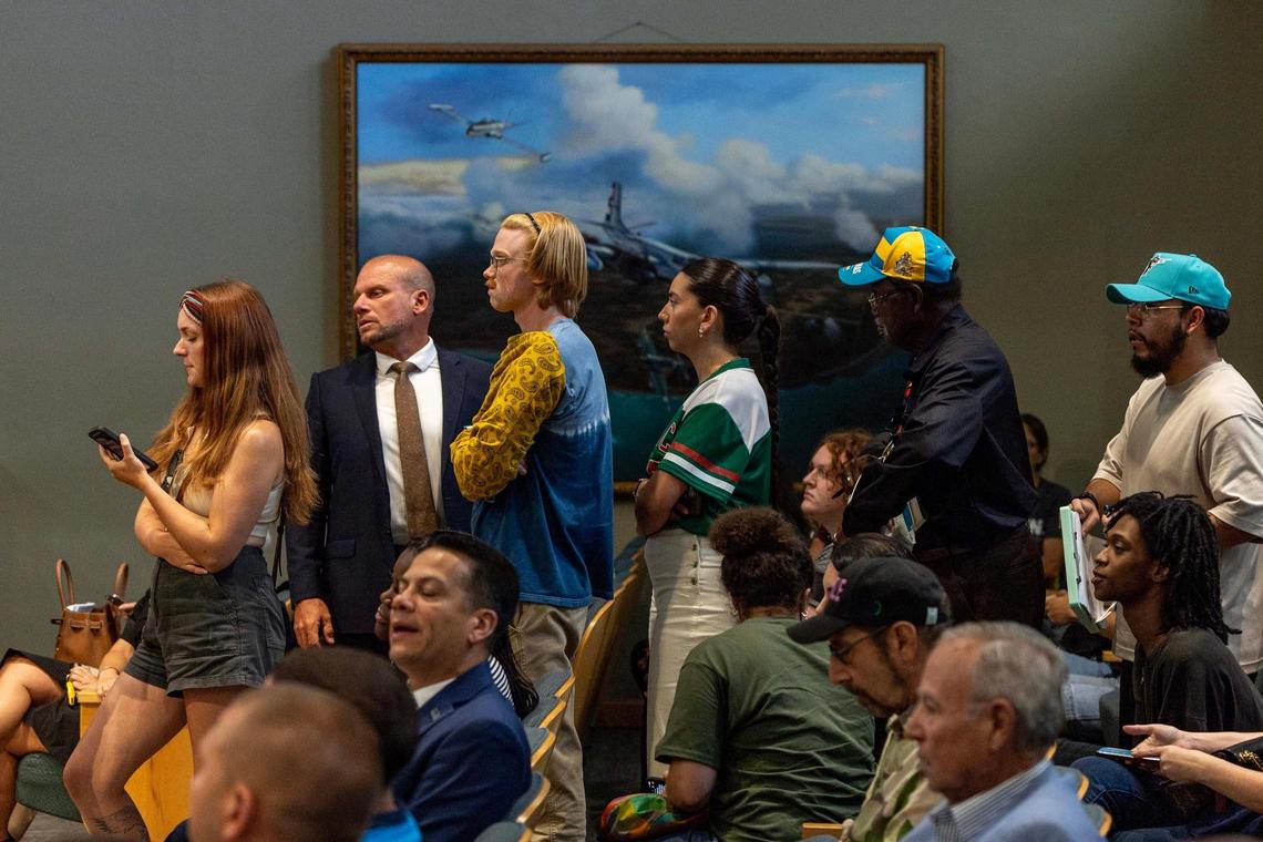 Members of the public wait their turn to speak during a commission meeting on Tuesday, June 17, 2025, in Miami.