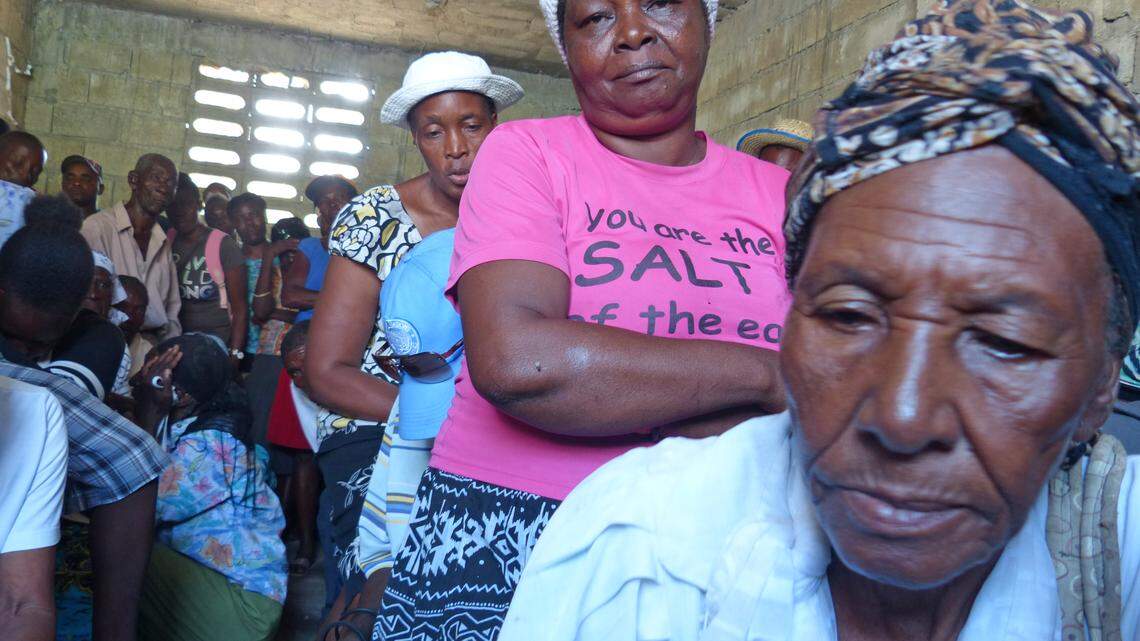 In a July 2017 file image, cholera victims, some of whom have lost multiple family members to the waterborne disease that causes life threatening vomiting and diarrhea, crowd a school house in Haiti's Cité Soleil slum in Port-au-Prince.