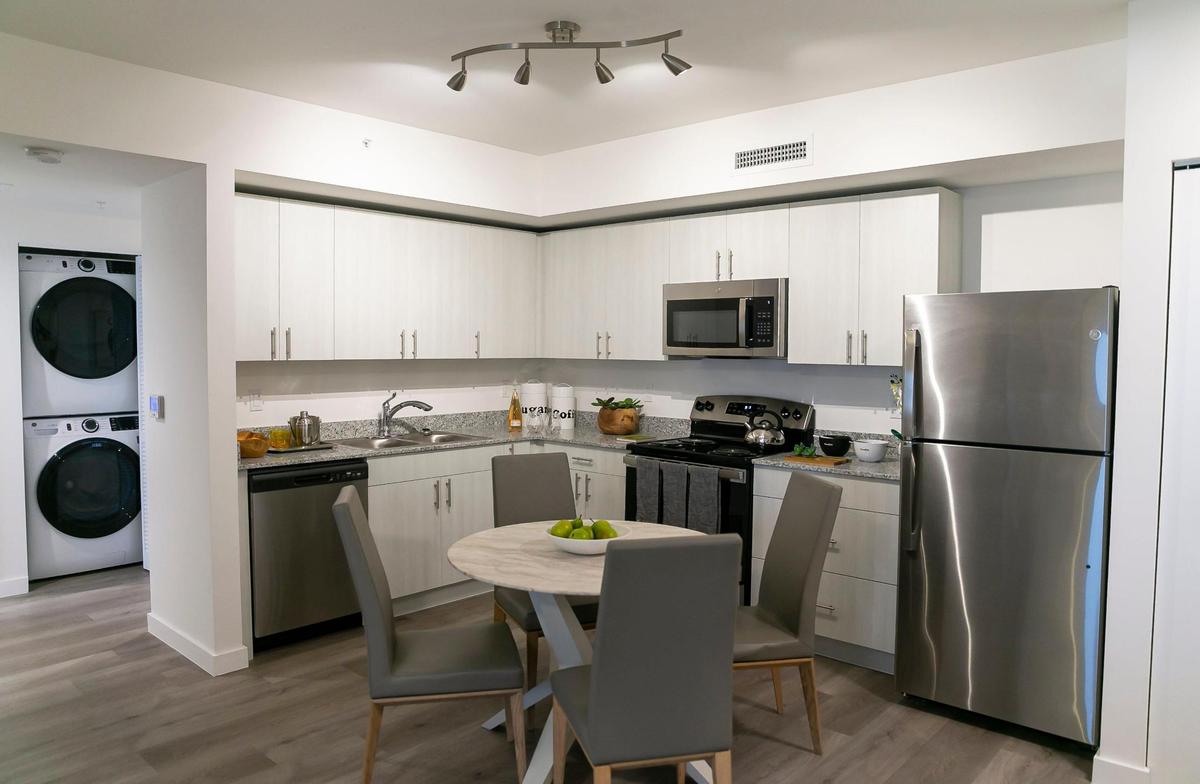 All residences have the same finishes and appliances — salt-and-pepper colored granite kitchen counters, General Electric stainless-steel appliances and hurricane-impact windows.&nbsp;