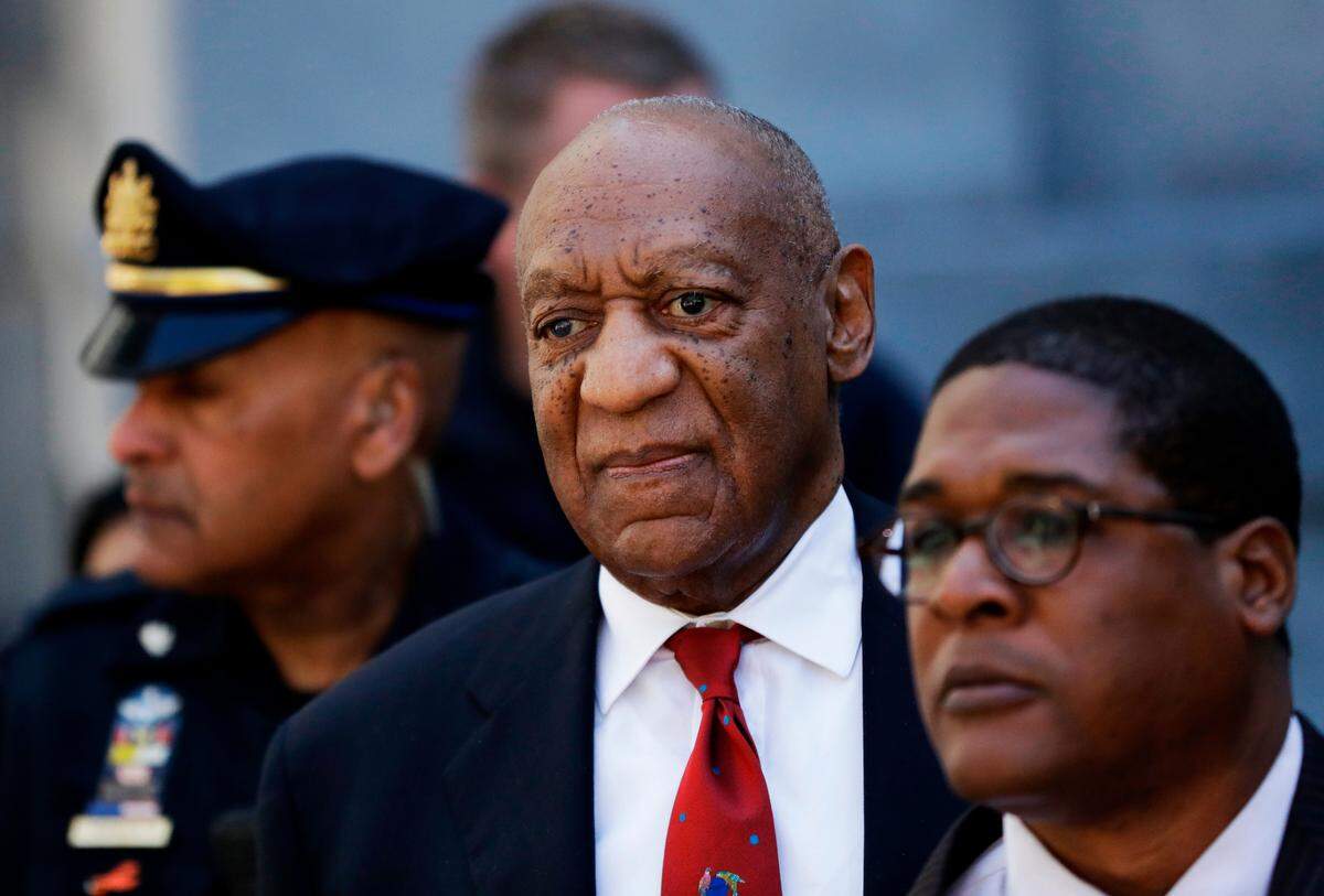 Bill Cosby, center, leaves the the Montgomery County Courthouse in Norristown, Pa. , in 2018. Pennsylvania’s highest court has overturned comedian Bill Cosby’s sex assault conviction. The court said Wednesday that they found an agreement with a previous prosecutor prevented him from being charged in the case.