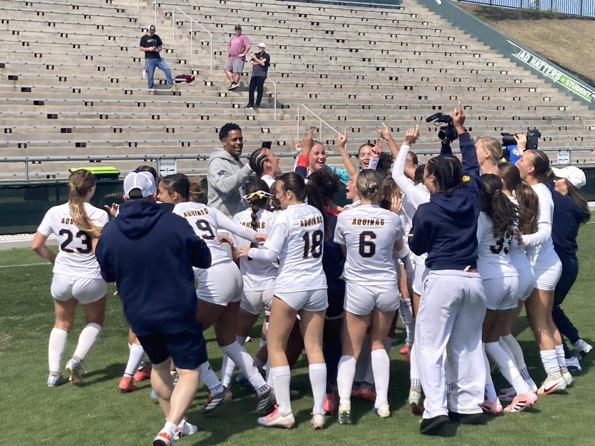 St. Thomas Aquinas’ girls’ soccer team celebrates at midfield at Spec Martin Stadium in DeLand, Fla. on Wednesday after winning the Class 6A state championship.