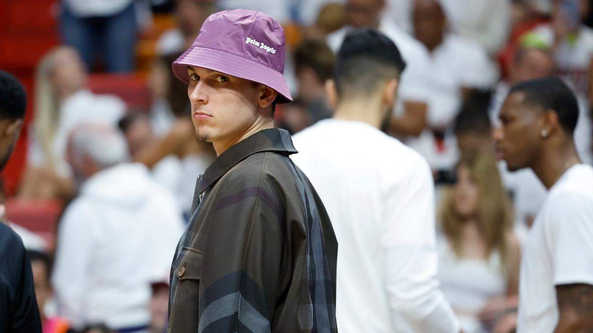 An injured Miami Heat guard Tyler Herro (14) stands on the court during a timeout during the game against the Boston Celtics in Game 4 of the NBA Eastern Conference Finals at Kaseya Center in Miami on Tuesday, May 23, 2023.