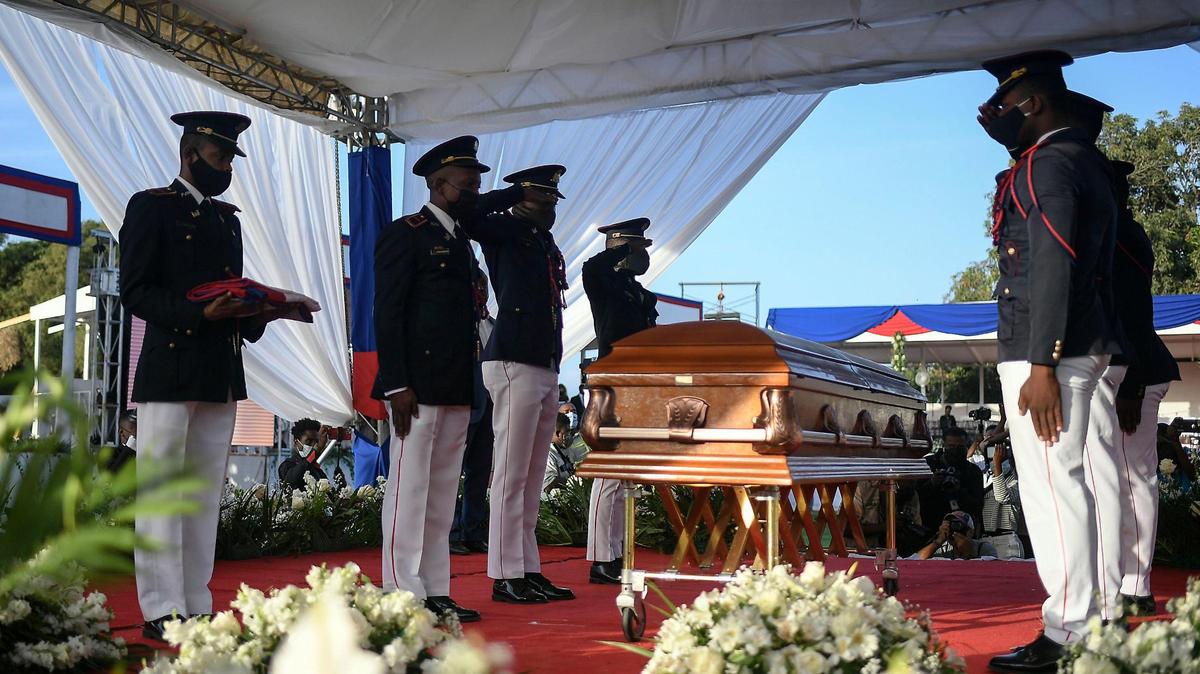 Police stand by the coffin of slain Haitian President Jovenel Moïse during his funeral at his family home in Cap-Haitien, Haiti, early Friday, July 23, 2021. Moïse was assassinated at his home in Port-au-Prince on July 7.