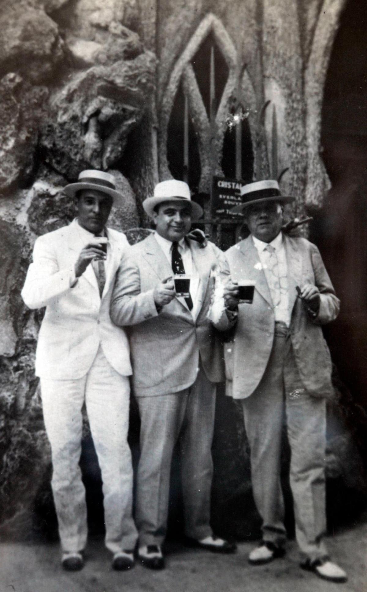 In this 1930 photograph taken at the Tropicana Gardens in Havana, Cuba. Al Capone, center, stands with his Lawyer J. “Fritz” Gordon, left, and Alex Fernandez. The caption on the photo says Fernandez is the unofficial mayor of Havana.