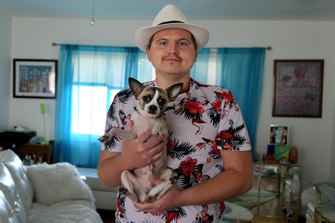 Tyler Borjas, 25, with his Chihuahua, Tito.