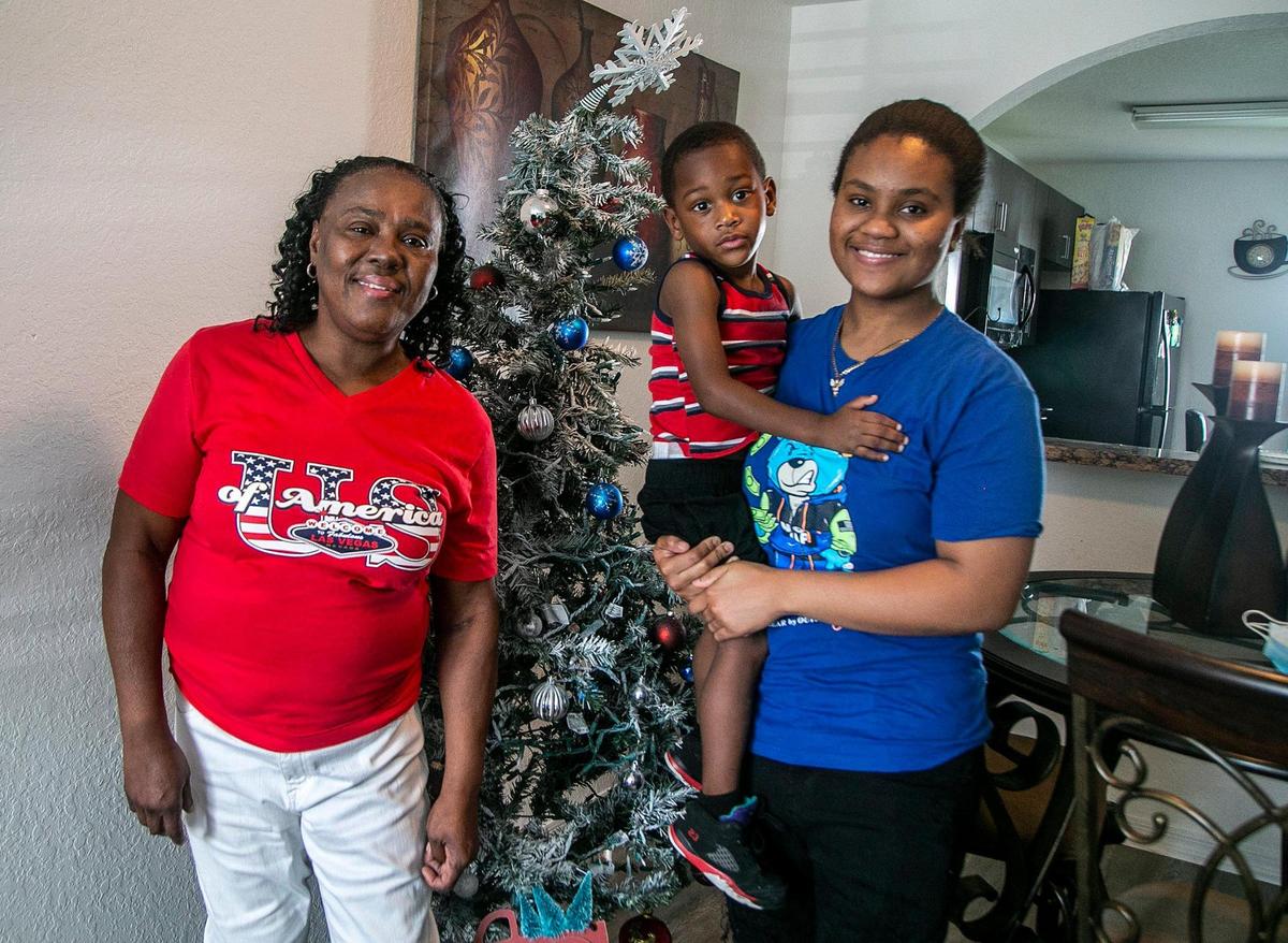 Deloris Brown with her great nephew, Keenin Brown, whom she adopted, and her daughter Sha-Ron Brown at their house in Florida City. She is 60 and on daily dialysis.