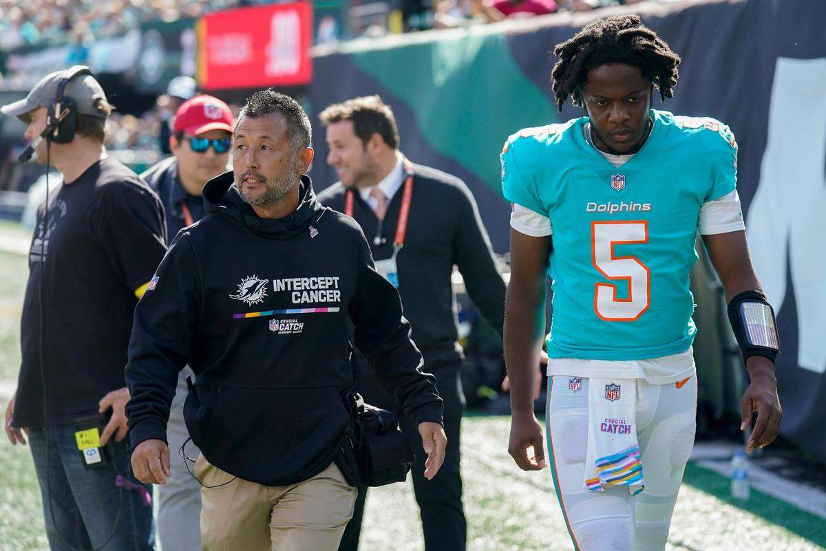 Miami Dolphins quarterback Teddy Bridgewater (5) leaves the field after taking a hit from the New York Jets during the first quarter of an NFL football game, Sunday, Aug. 9, 2022, in East Rutherford, N.J. (AP Photo/Seth Wenig)
