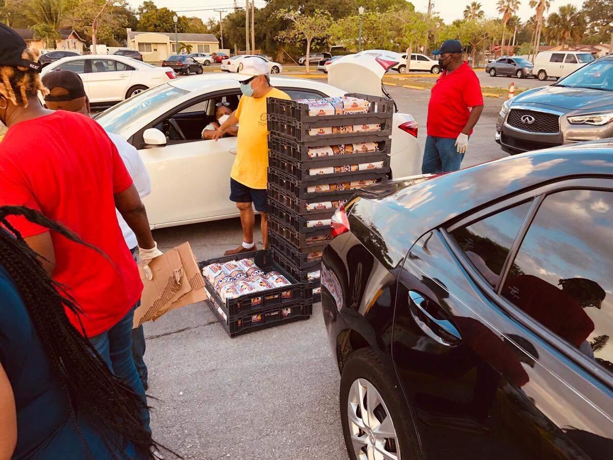 Volunteers with the Rotary Club at a food giveaway in Opa-locka on April 22, 2020. Felipe Madrigal, the president of the Rotary Club in Doral, is in the yellow shirt.