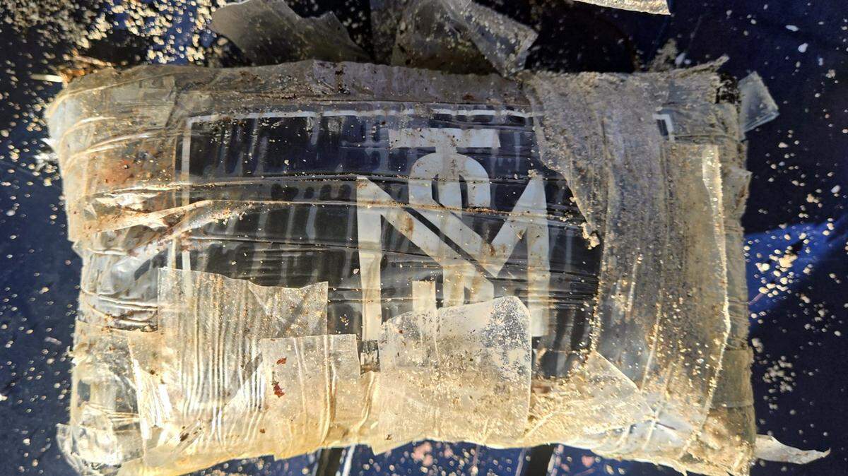 A wrapped brick of suspected cocaine is displayed by the Monroe County Sheriff’s Office. The approximately 1-kilogram package was found during a Florida Keys beach cleanup Monday, Oct. 27, 2025, the sheriff’s office said.