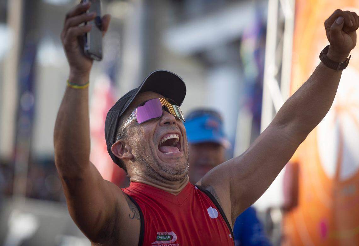 A man shouts as he crosses the finish line during the Life Time Miami Marathon and Half on Sunday, Jan. 28, 2024, finishing at Bayfront Park in downtown Miami.
