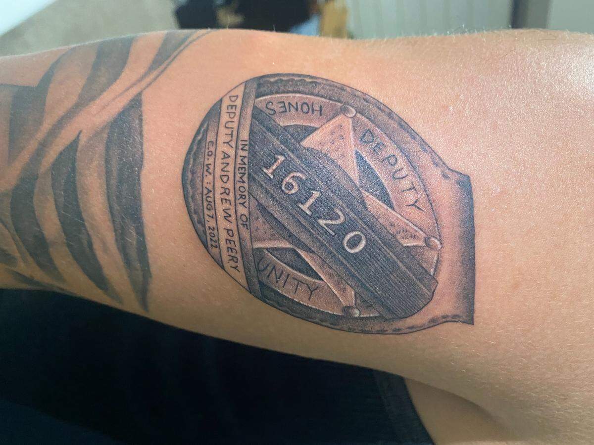 FIU backup quarterback Chayden Peery honors his uncle, Deputy Andrew Peery, a police officer who was killed in the line of duty in August of 2022, with a tattoo on his left triceps.