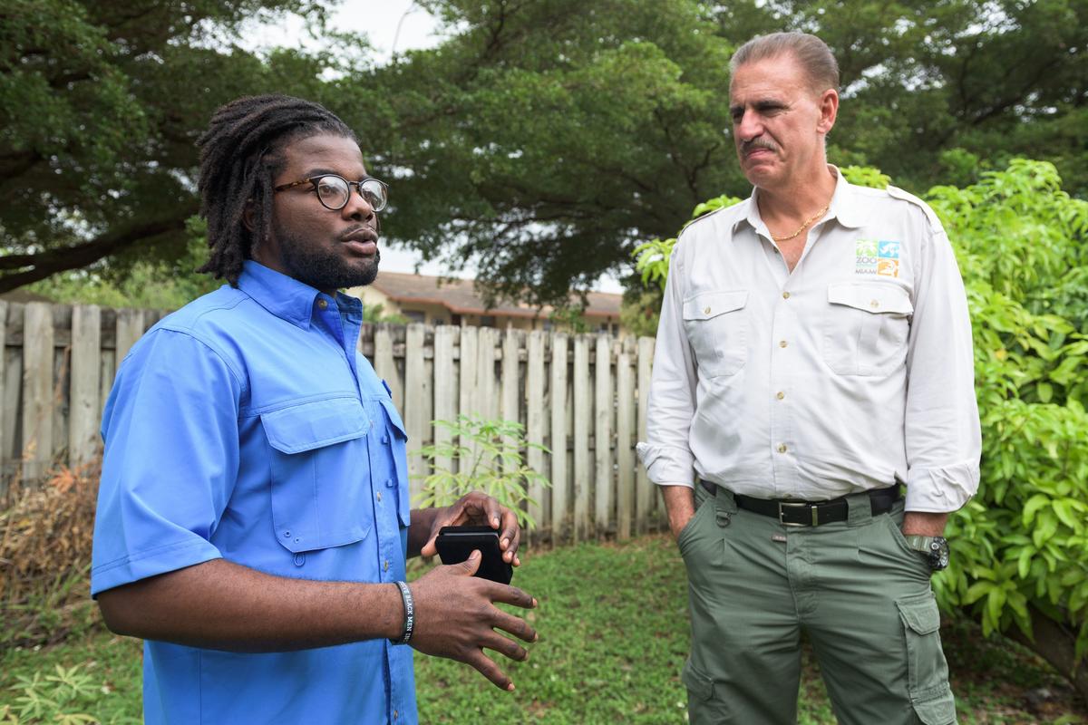 Herby Zephir and Zoo Miami’s Ron Magill talk about conservation efforts after Magill presented Zephir with the Ron Magill Conservation Endowment scholarship at his home in Homestead on Dec. 20, 2019.