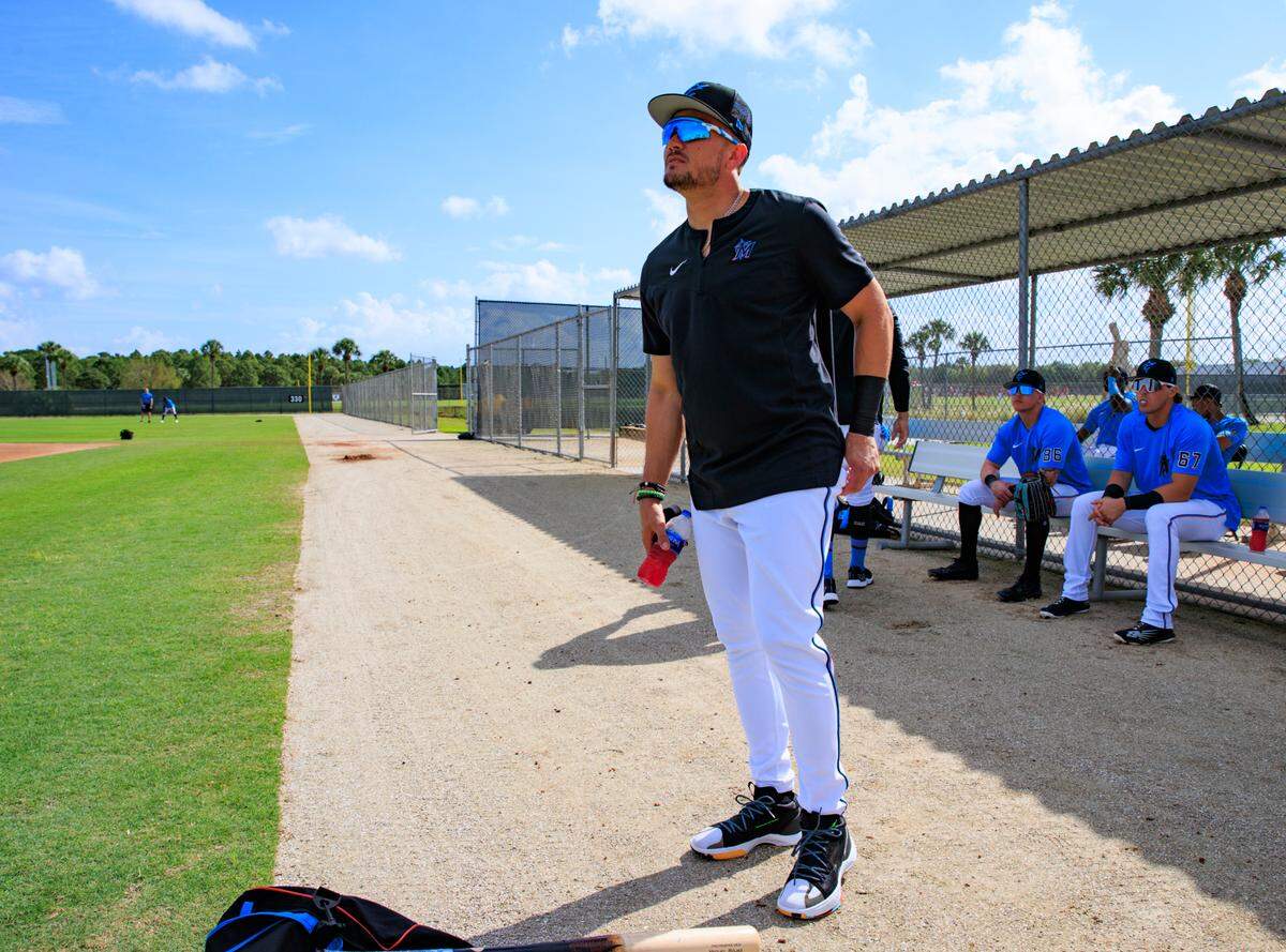 Miami Marlins shortstop Miguel Rojas looks on during their spring training workout at Roger Dean Stadium on Wednesday, March 16, 2022 in Jupiter, FL.