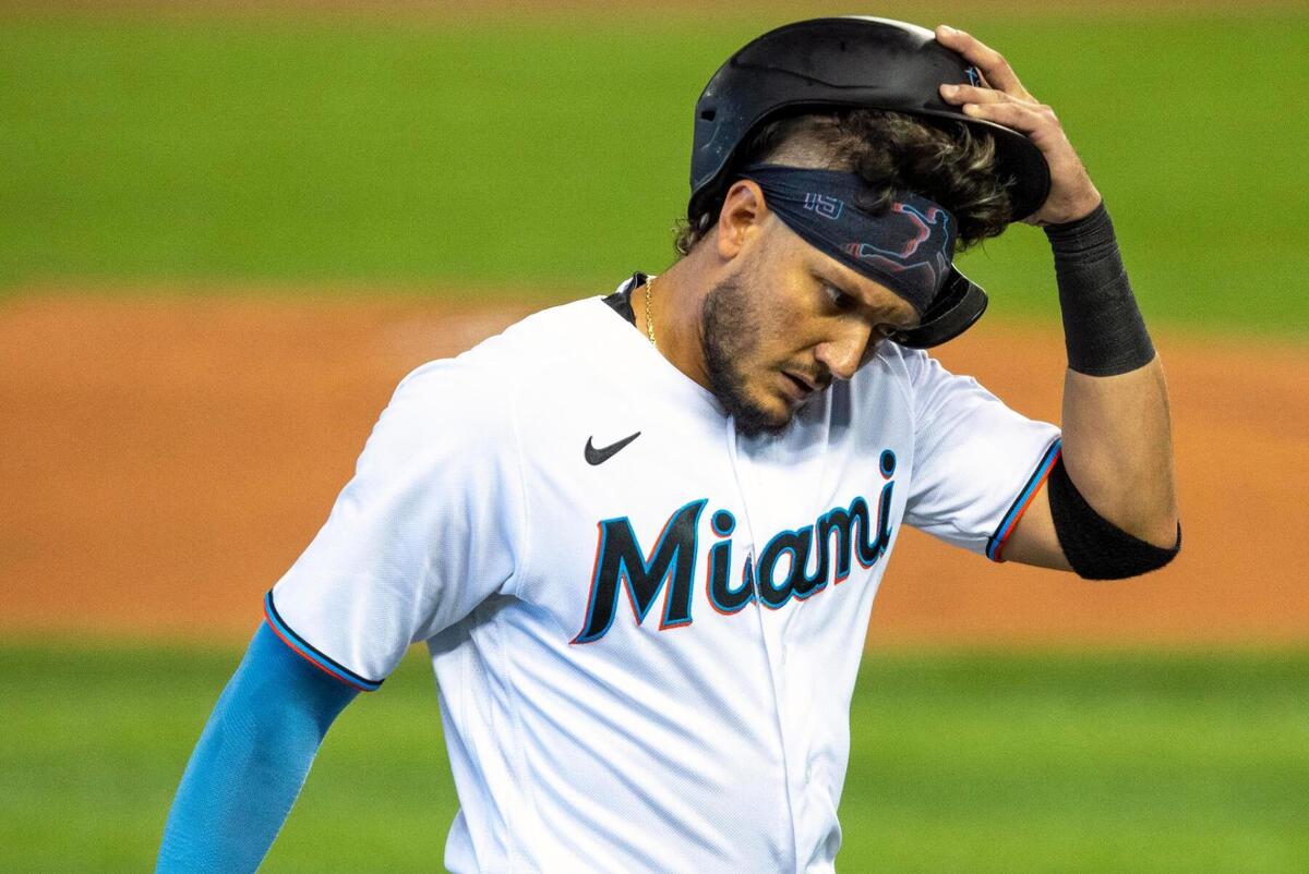 Miami Marlins shortstop Miguel Rojas&nbsp;(19) reacts to being caught stealing third base during the first inning of an MLB game against the San Francisco Giants at loanDepot park in the Little Havana neighborhood of Miami, Florida, on Sunday, April 18, 2021.
