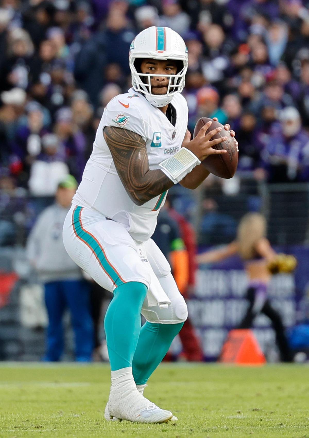 Miami Dolphins quarterback Tua Tagovailoa (1) look to pass during first half of an NFL football game against the Baltimore Ravens at M&T Bank Stadium in Baltimore, Maryland on Sunday, December 31, 2023.