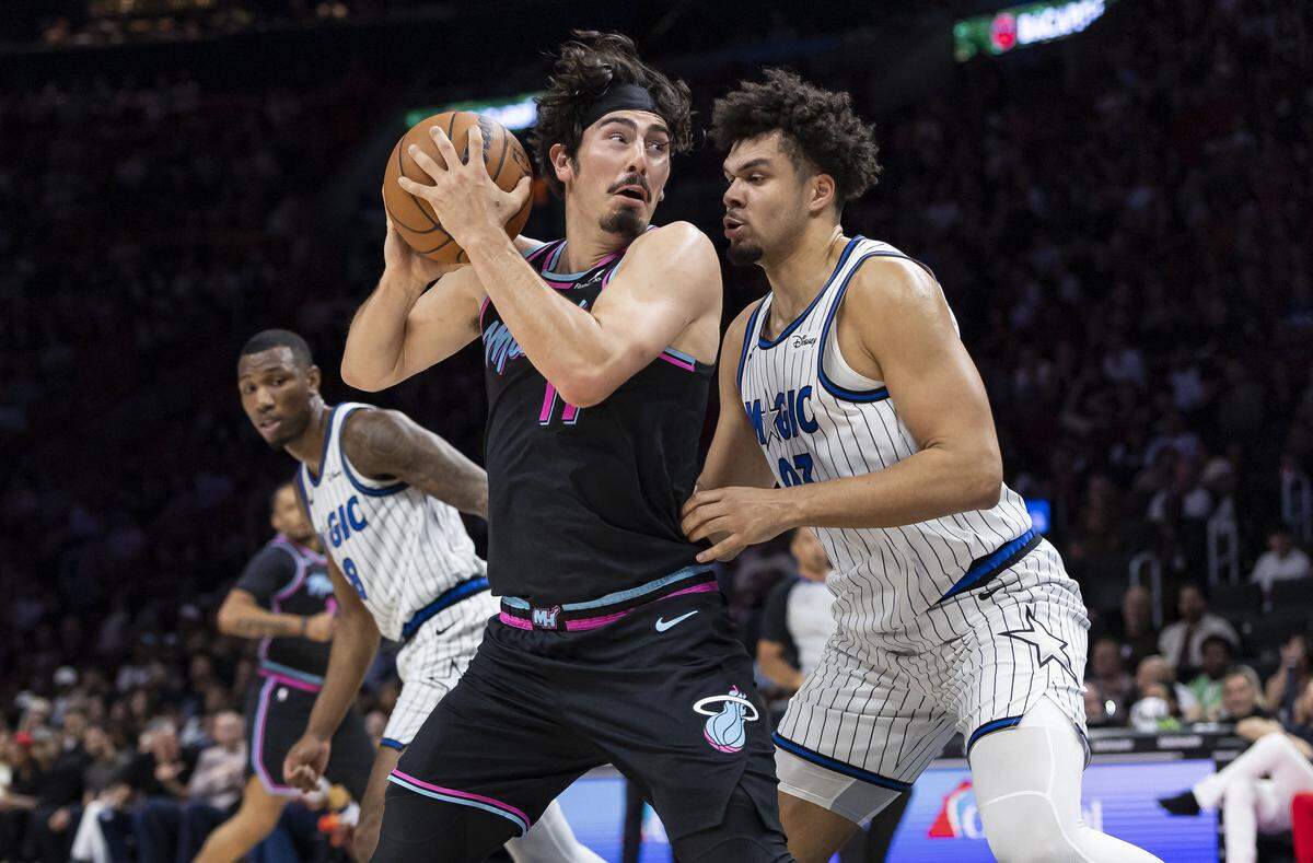 Miami Heat forward Jaime Jaquez Jr. (11) looks for a teammate as Orlando Magic forward Noah Penda (93) defends in the first half of their NBA game at Kaseya Center on March 14, 2026, in Miami.