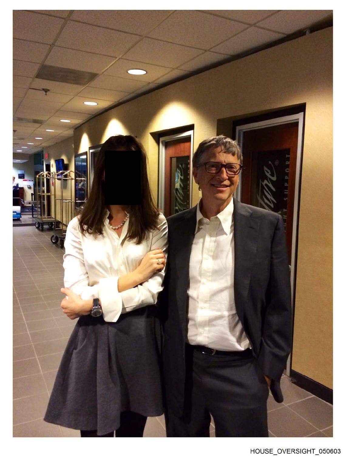 Billionaire co-founder of Microsoft Bill Gates is seen here with a woman whose face is redacted, in a photo produced by the estate of Jeffrey Epstein and released on Dec. 18, 2025, by the House Committee on Oversight and Government Reform.