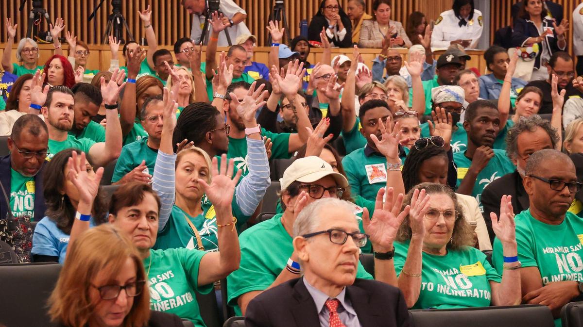 Miramar residents and members of environmental groups show support for a speaker urging Miami-Dade commissioners not to build an incinerator at the Airport West site near Miramar. The meeting took place on on Tuesday, Sept. 17, 2024.
