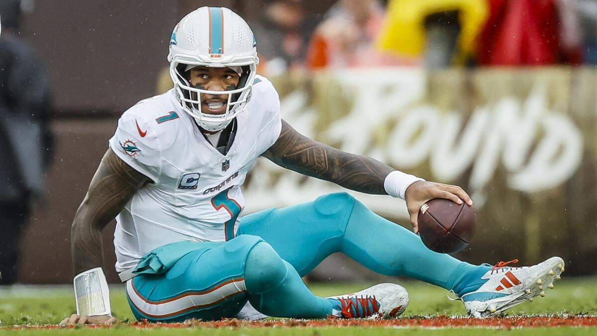 Miami Dolphins quarterback Tua Tagovailoa (1) is sacked by Cleveland Browns during the first half of an NFL football game at Huntington Bank Field in Cleveland, Ohio, on Sunday, October 19, 2025.