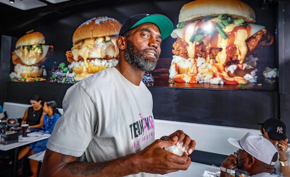 NFL football Hall of Famer Randy Moss looks out the front window of his Crisppi’s Chicken franchise at 29th street and Biscayne Boulevard in Miami, Florida, on Friday, July 11, 2025.