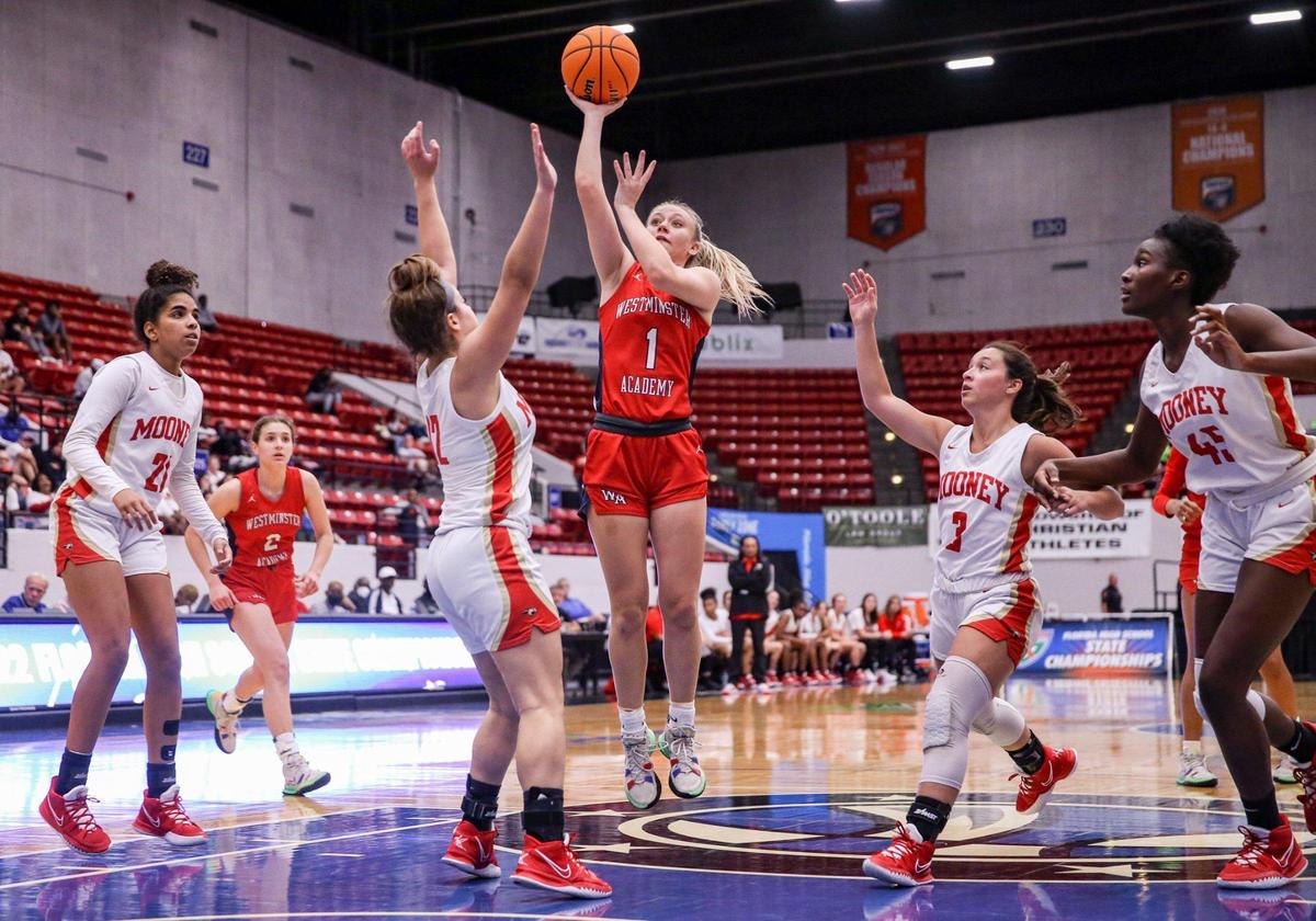 Westminster Academy’s Claire Erickson (1) takes a shot at the basket as Cardinal Mooney defends in a Class 3A girls basketball state championship at the RP Funding Center in Lakeland on Friday, February 25, 2022.