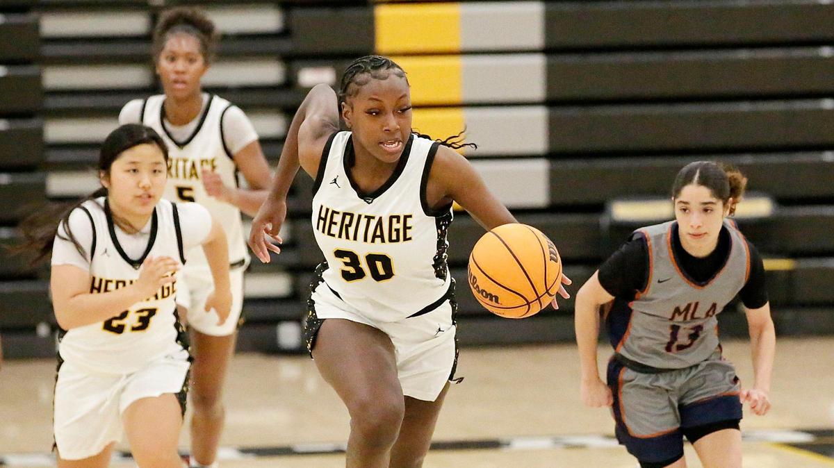 American Heritage Patriots Dezuray McGill (30) drives to the basket during 2025 FHSAA Region 4A District 15 Girls Basketball final game against Mater Lakes Academy Bears on Friday, February 21, 2025 at American Heritage HS in Plantation. Andrew Uloza / for Miami Herald