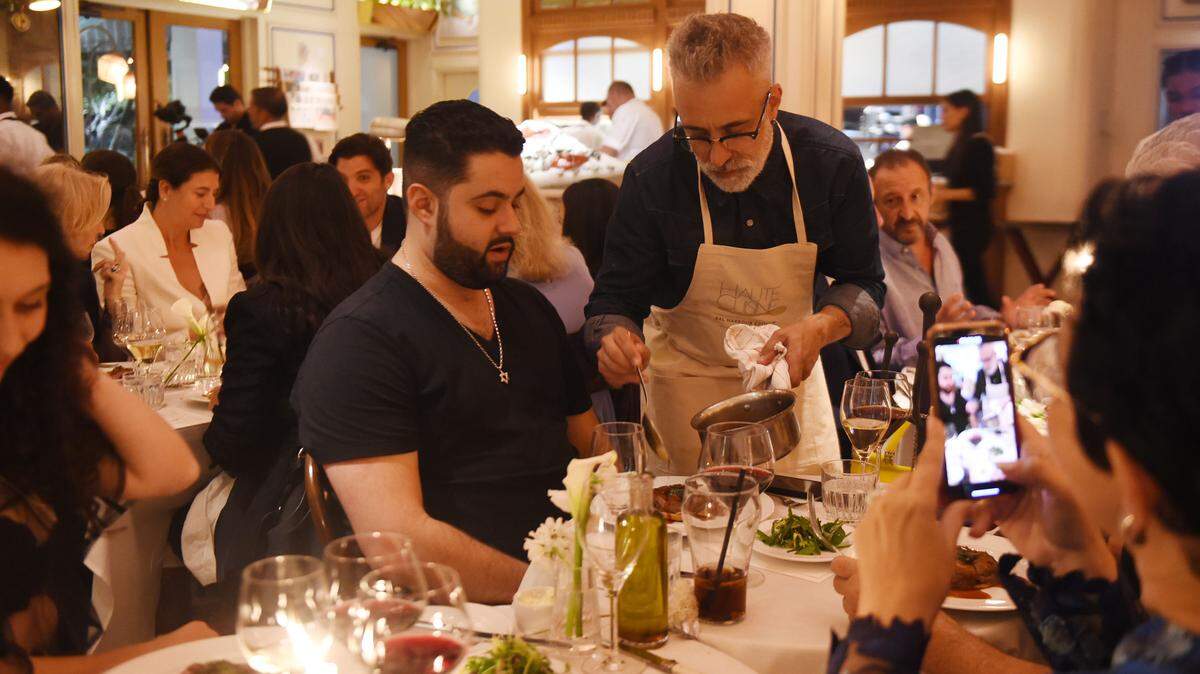 Sergi Arola serves Brandon Shpirt at last year’s Haute Cuisine dinner at Le Zoo in Bal Harbour.