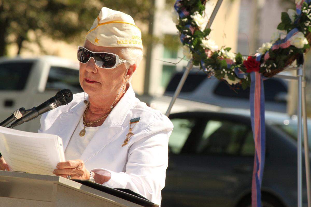 Georgie Carter-Krell of Virginia Gardens speaks about sacrifices made by veterans to protect American freedoms. Carter-Krell was the keynote speaker at the Veterans Day observance at the Miami Springs War Memorial last year. On her right lapel, the Congressional Medal of Honor ribbon awarded to her son, Marine Pvt. First Class Bruce Carter, who died in Vietnam in 1969 after jumping on a hand grenade to protect his fellow soldiers.