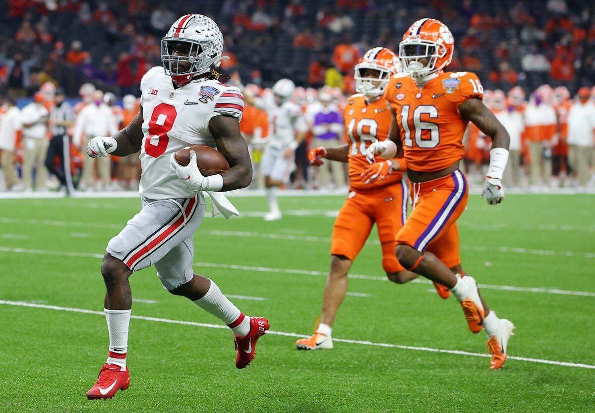 NEW ORLEANS, LOUISIANA - JANUARY 01: Trey Sermon #8 of the Ohio State Buckeyes scores a touchdown against Ray Thornton III #16 of the Clemson Tigers in the first quarter during the College Football Playoff semifinal game at the Allstate Sugar Bowl at Mercedes-Benz Superdome on January 01, 2021 in New Orleans, Louisiana. (Photo by Kevin C. Cox/Getty Images)