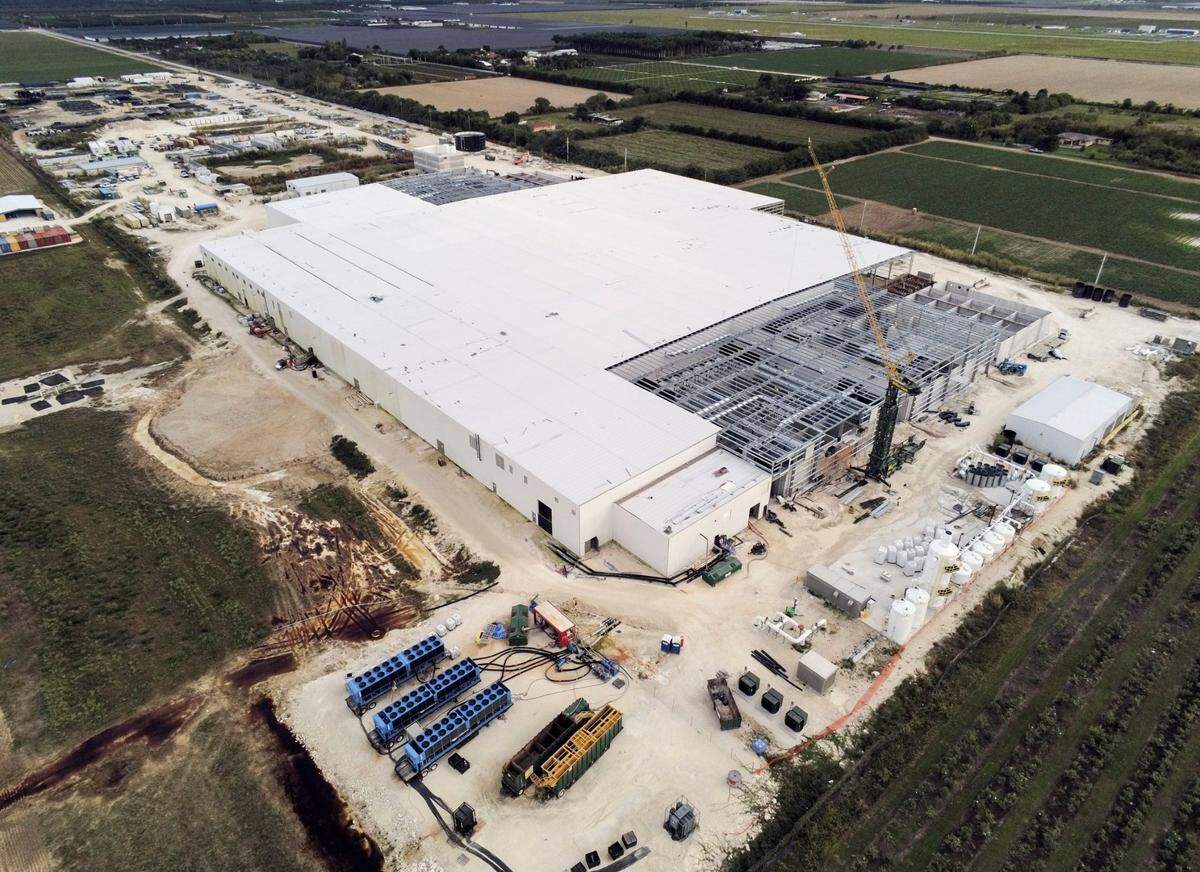Just painting a roof white, as in this 9-acre production facility for the salmon-farming company Atlantic Sapphire, can lower cooling costs.