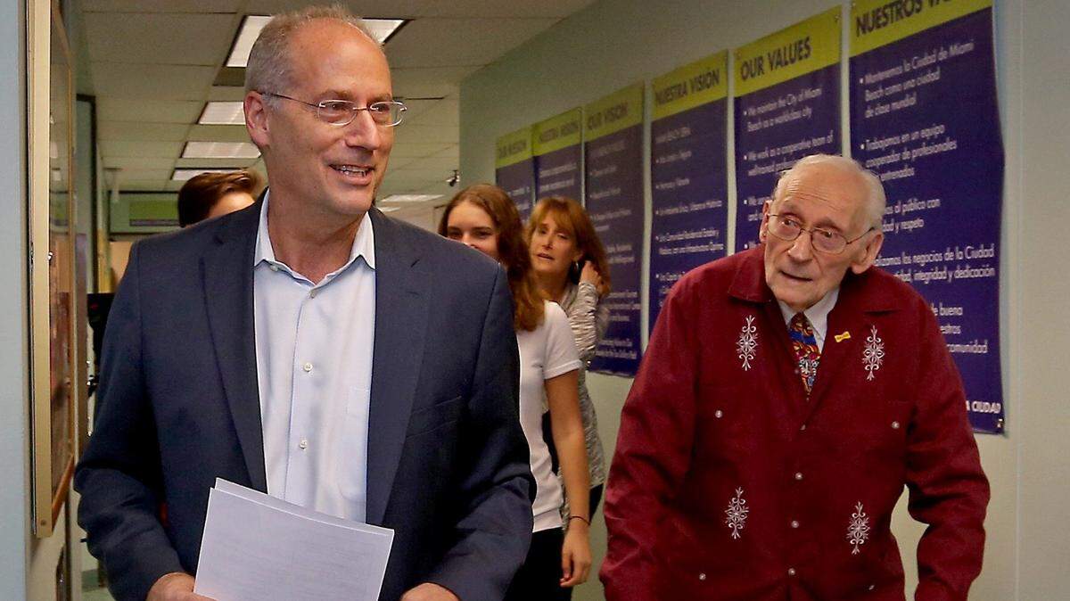Senator Dan Gelber (left) arrives at Miami Beach City Hall on Jan. 31, 2017, with his father and former Miami Beach mayor Seymour Gelber (right) to file paperwork for his first run for mayor. Gelber announced Thursday that he plans to seek re-election.