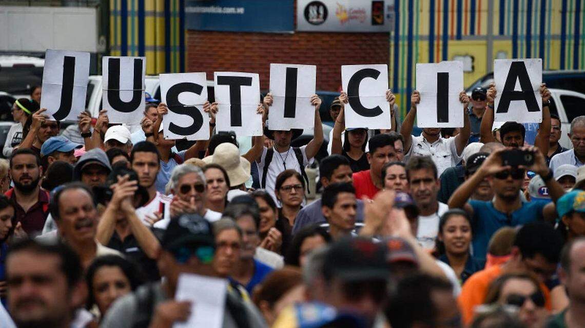 Opposition supporters in Caracas listen to Juan Guaidó, head of Venezuela’s National Assembly who declared himself president in 2019.