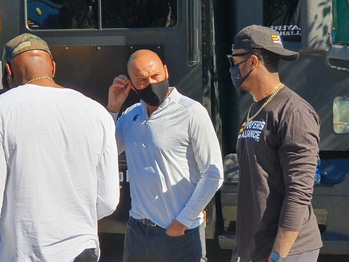 Miami Marlins CEO Derek Jeter and outfielder Monte Harrison participate in the Players Alliance’s Pull Up Neighbor Tour stop at Overtown’s Gibson Park on Tuesday, Jan. 5, 2021.