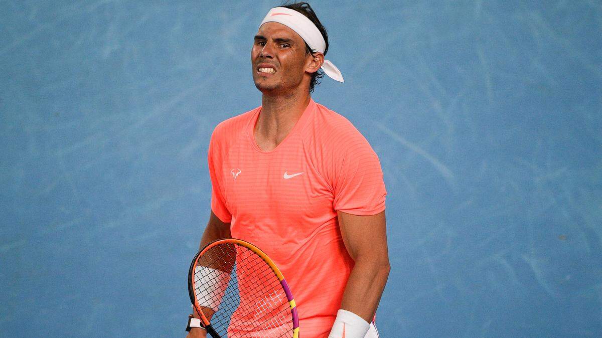 Spain’s Rafael Nadal reacts after losing a point against Greece’s Stefanos Tsitsipas during their quarterfinal match at the Australian Open tennis championship in Melbourne, Australia, Wednesday, Feb. 17, 2021. Nadal withdrew from the Miami Open with back injury.