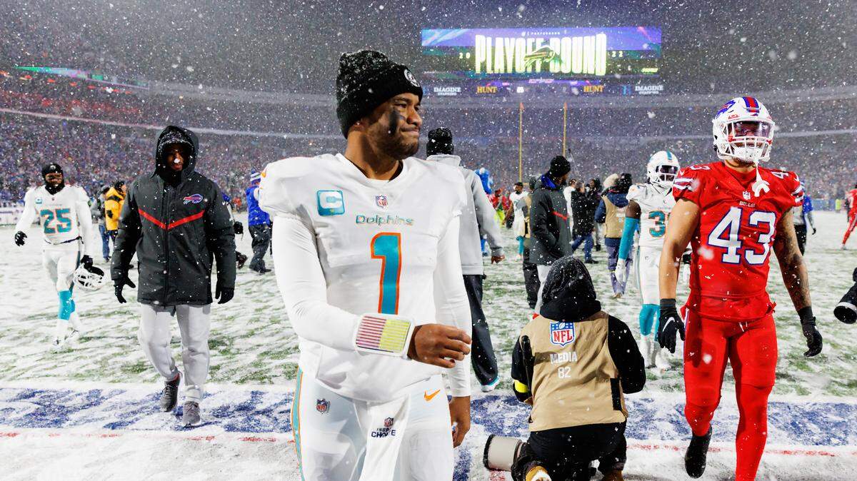 Miami Dolphins quarterback Tua Tagovailoa (1) walks off the field after the 32-29 loss to the Buffalo Bills during an NFL football game at Highmark Stadium on Saturday, December 17, 2022 in Orchard Park, New York.