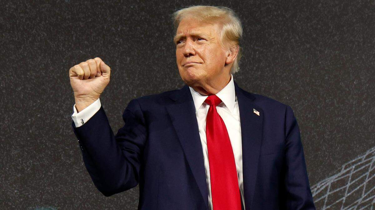 Former President Donald Trump pumps his fist during the Turning Point Believers Summit at the Palm Beach County Civic Center in West Palm Beach on Friday, July 26, 2024. He urged the audience to vote in the November election, saying, ‘In four years, you don’t have to vote again.’