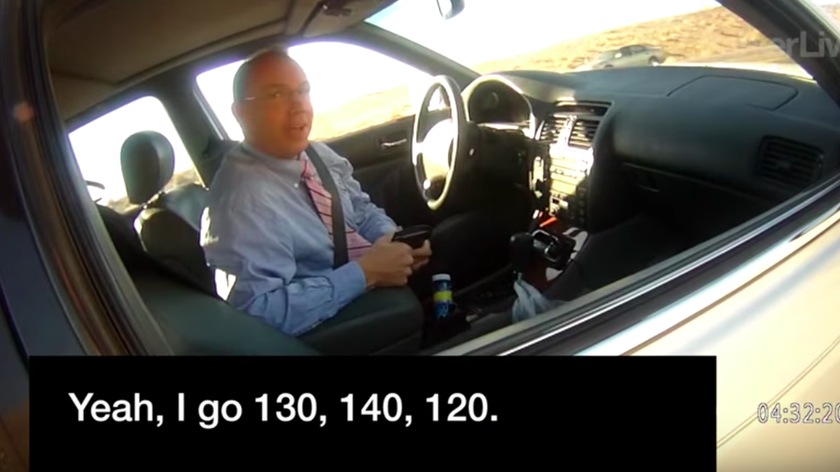 Arizona state Rep. Paul Mosley speaks to a deputy about how fast he says he sometimes goes in his car.