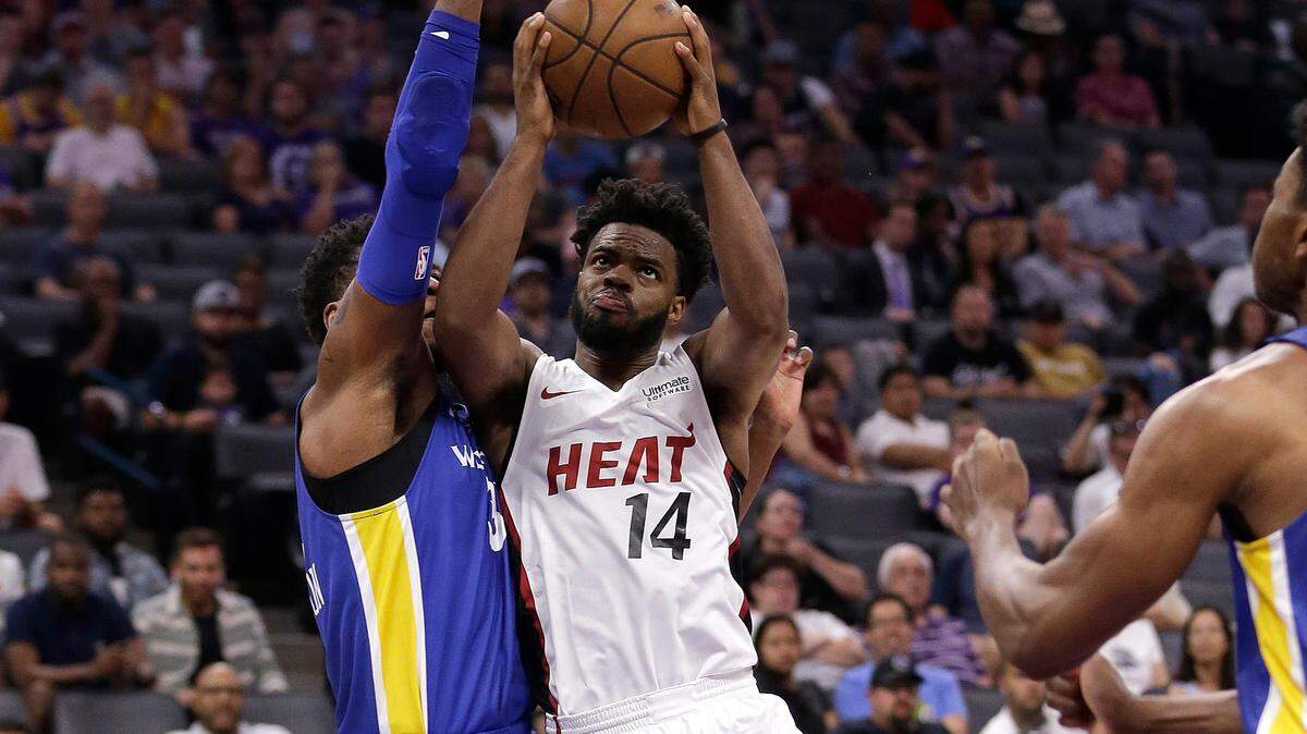 Miami Heat guard Derrick Walton Jr., right, goes to the basket against Golden State Warriors forward Marcus Derrickson, right, during the first half of an NBA summer league basketball game Monday, July 2, 2018, in Sacramento, Calif. (AP Photo/Rich Pedroncelli)