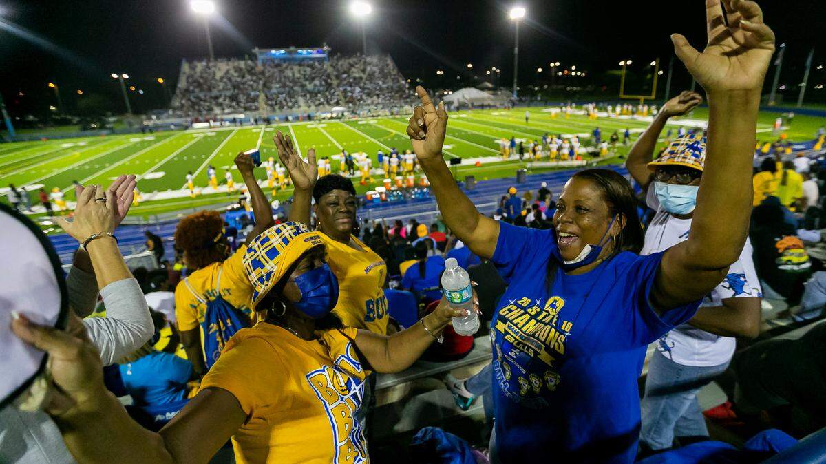 Northwestern Bulls fans cheer after their football team scored against the Miami Central Rockets on Friday, October 1, 2021 at Nathaniel Traz Powell Stadium in Miami, Florida.