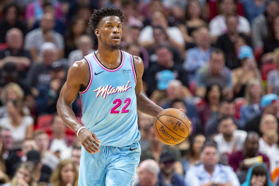 Miami Heat forward Jimmy Butler (22) dribbles the ball during a game against the Philadelphia 76ers at AmericanAirlines Arena on Saturday, December 28, 2019.