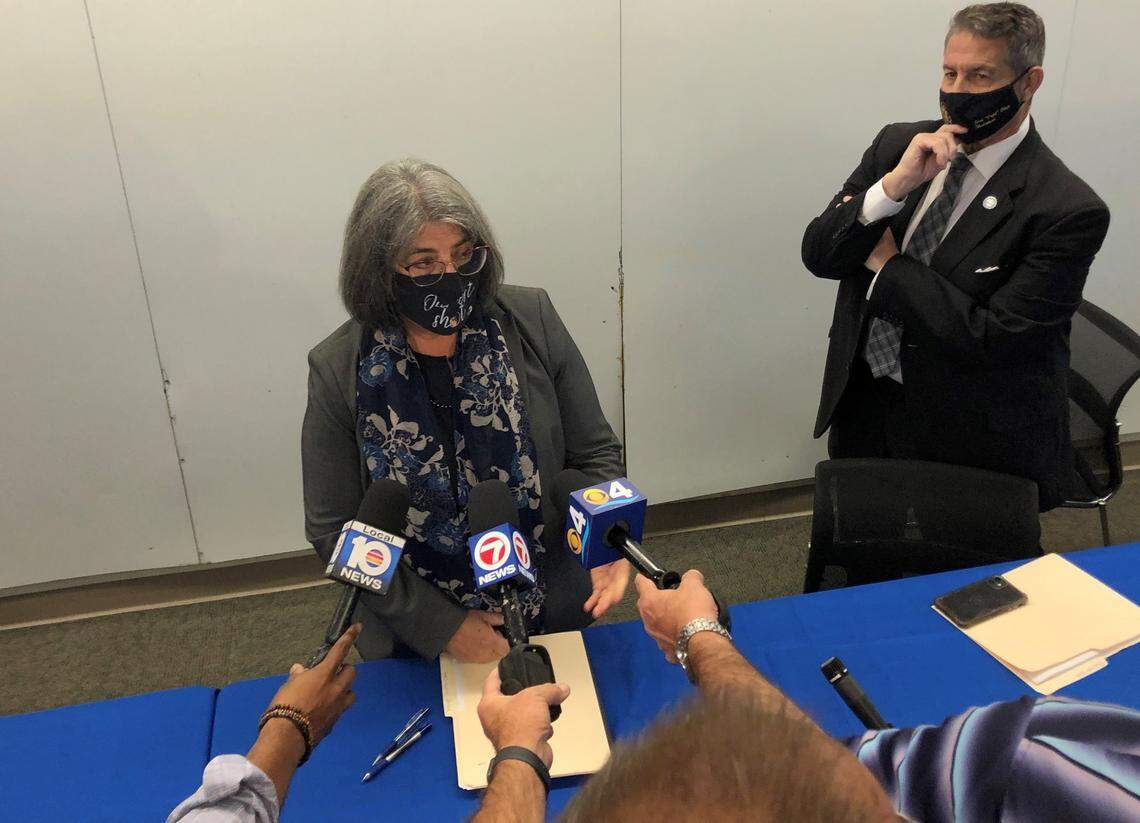 Miami-Dade Mayor Daniella Levine Cava addresses reporters on Aug. 30, 2021, after co-chairing a panel on building-safety reforms after the Surfside collapse. The other chair of the panel, Jose “Pepe” Diaz, chairperson of the County Commission, is at right.