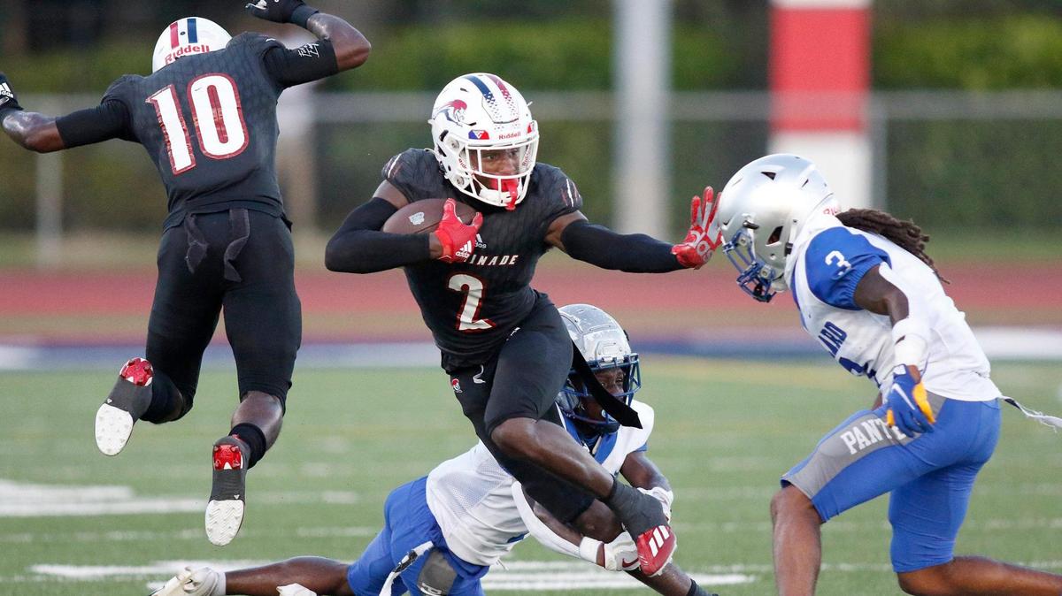 Chaminade-Madonna Lions wide receiver Edwin Joseph (2) tries to escape Dillard Panthers Tre’ Vaughn Martinez during football game on Friday, September 2, 2022 at Chaminade-Madonna HS in Hollywood. Andrew Uloza / for Miami Herald